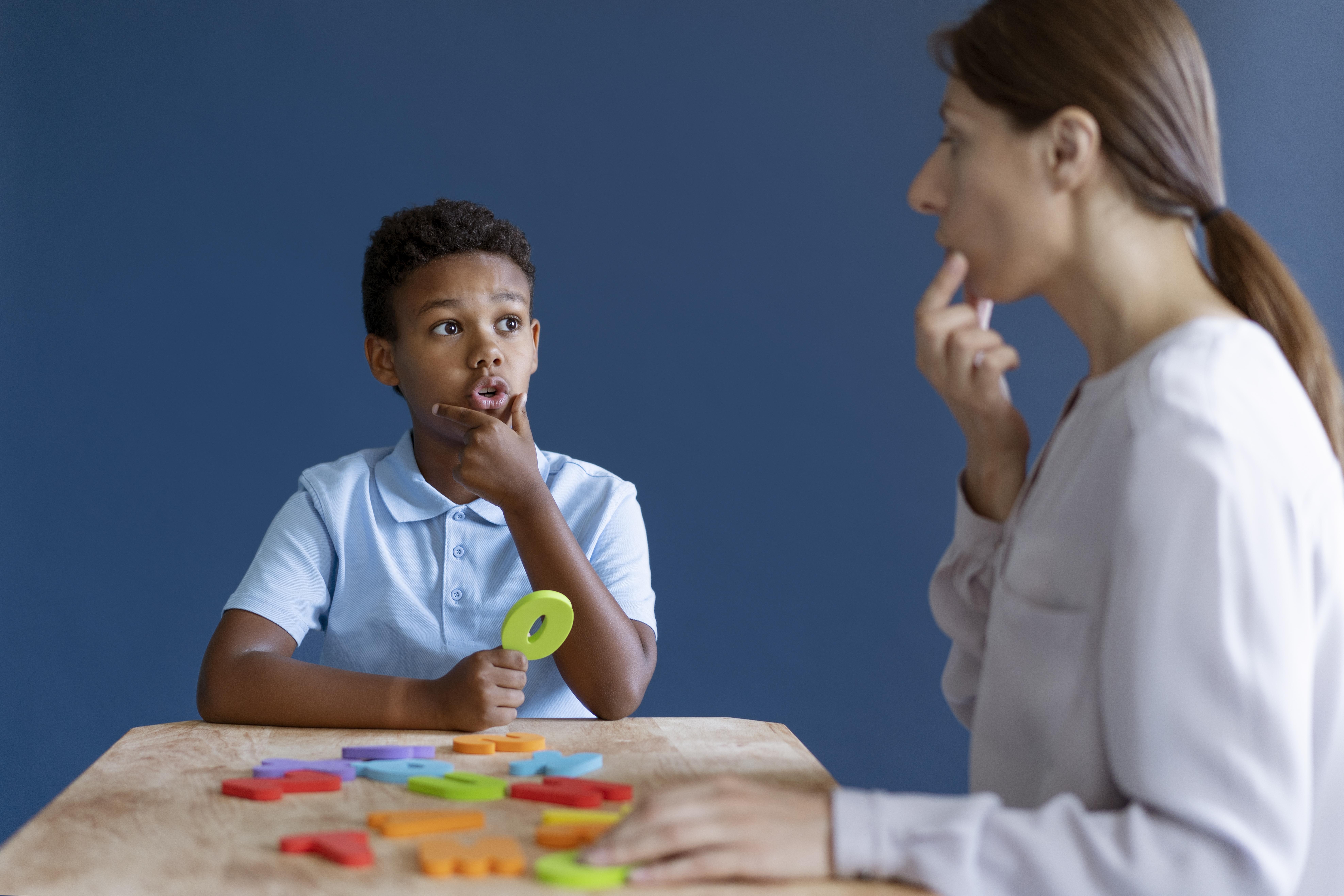 Child playing with therapist